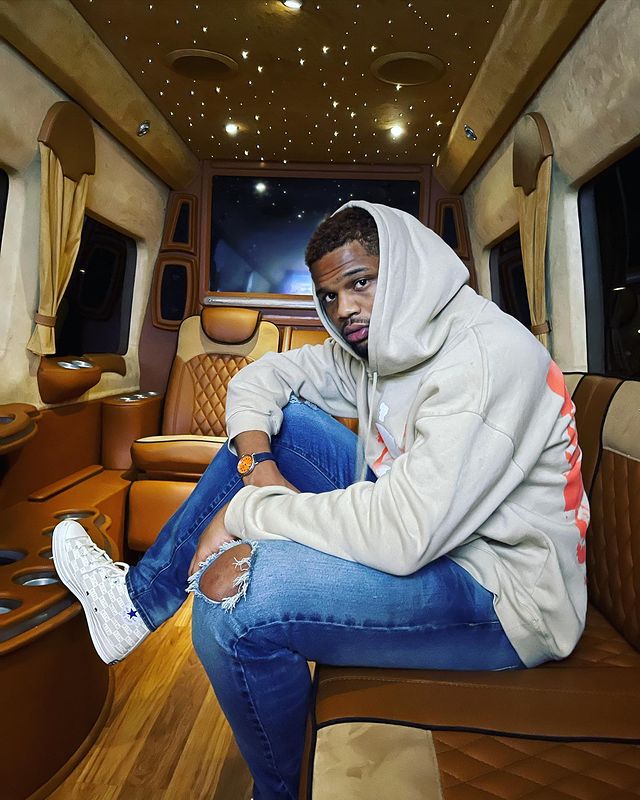 Daniel Lee Bellomy in a white hoodie and blue jeans.